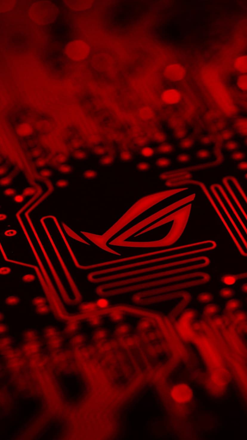Red Republic of Gamers logo glowing on a dark circuit board with neon light paths and blurred bokeh circles.