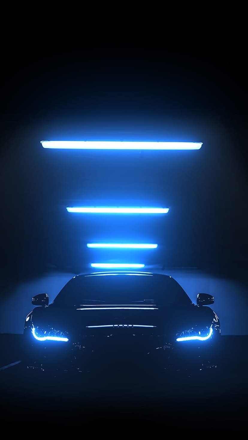 Dark supercar featuring glowing blue LED headlights and horizontal neon accents inside a low-light tunnel.