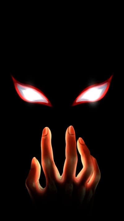 Glowing Red Eyes and Fiery Hand on Black Background