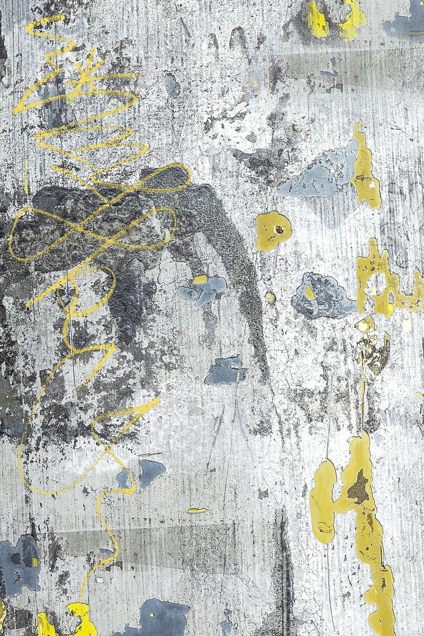 Weathered grey metal surface with peeling paint and bright yellow splatters creates a gritty industrial texture.