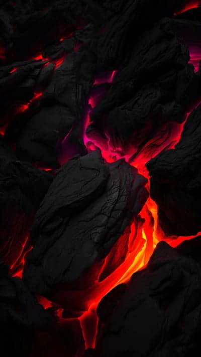 Fiery Lava Flowing Through Dark Volcanic Rock