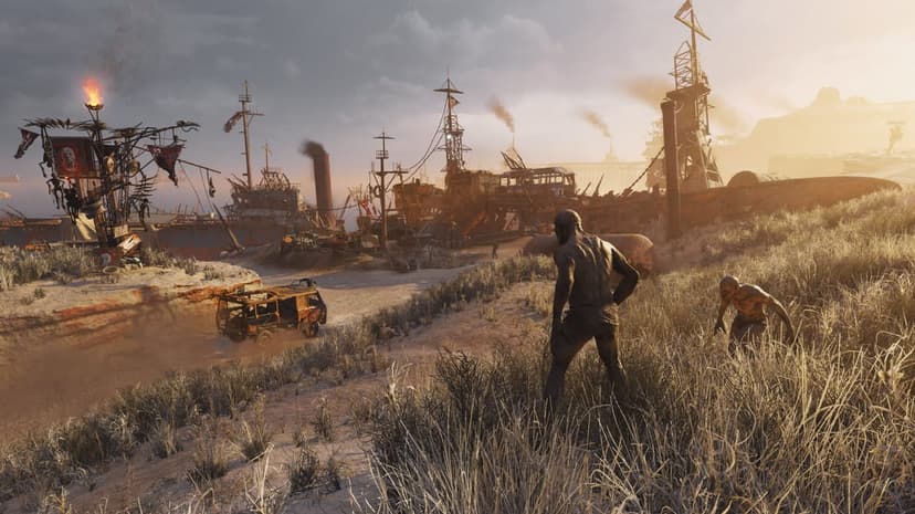 Two thin figures stand in dry grass near a rusted ship settlement in a dusty desert wasteland at sunset.