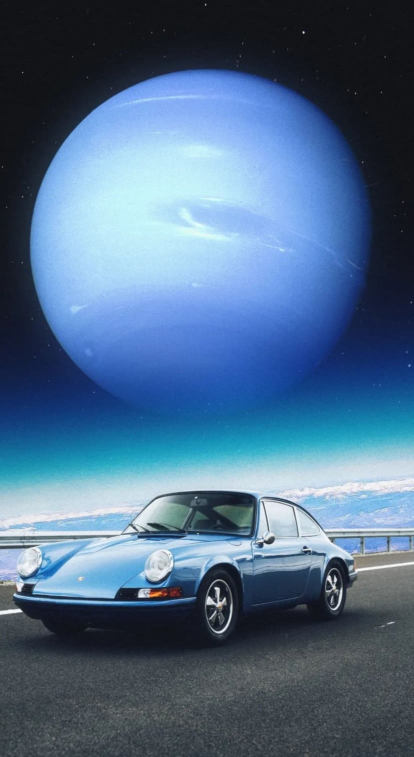 Vintage blue Porsche driving on a highway beneath a giant gas giant planet and a dense field of distant stars.