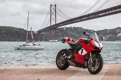 Red Ducati Panigale V4 Sportbike Lisbon Bridge Background