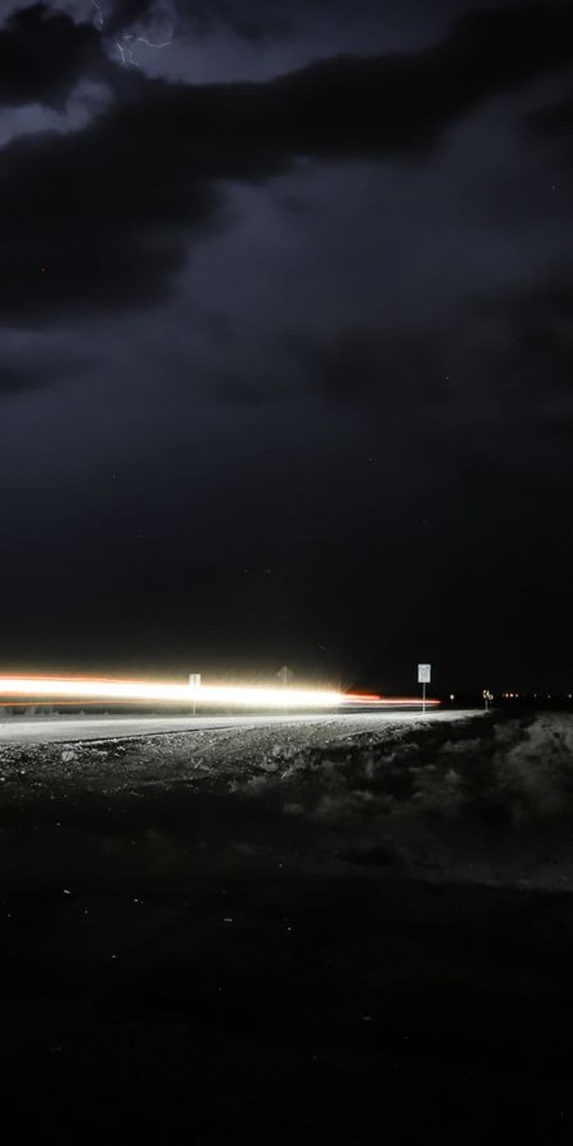 Kinetic Urban Light Streaks Stormy Sky Phone Background
