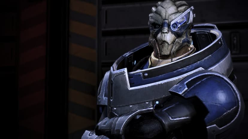 Garrus Vakarian Turian character wearing blue and silver armor with a glowing blue ocular eyepiece.