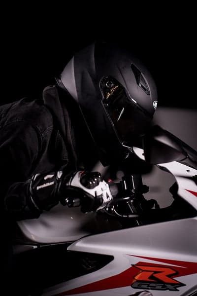 Motorcyclist in Black Gear on Sportbike