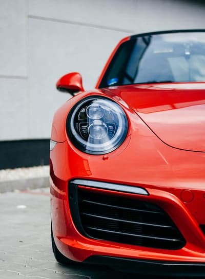Closeup Red Porsche 911 Headlight and Grille Detail