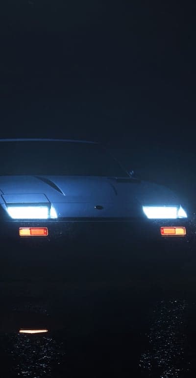 Vintage Car Headlights in Moody Night Scene