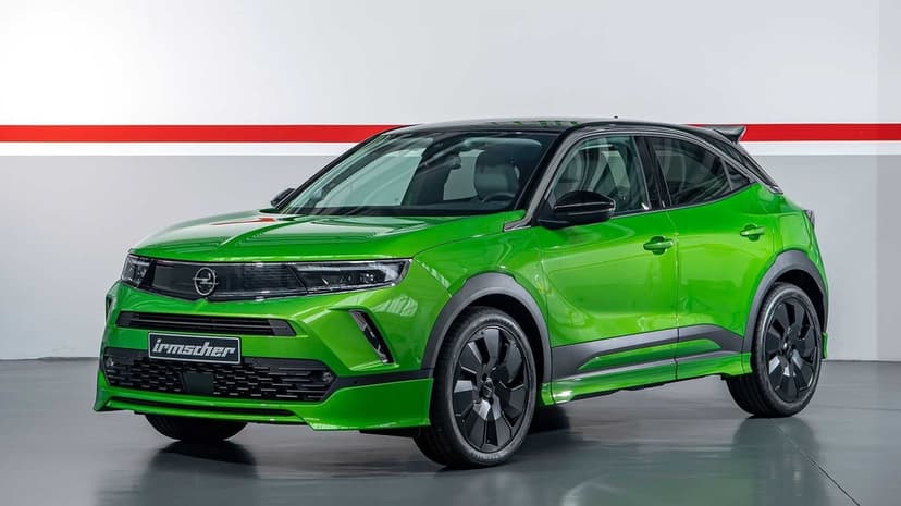 Lime green Opel Mokka SUV with black wheels and aggressive body kit in a clean white studio with a red stripe.