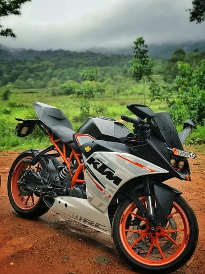 KTM RC Motorcycle in Lush Green Mountain Landscape