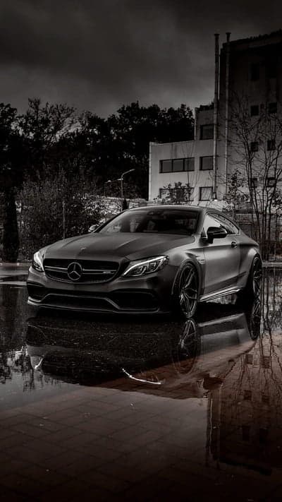 Dark Matte Mercedes Coupe Reflecting in Water
