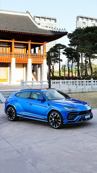 Blue Lamborghini Urus SUV Asian Temple Phone Wallpaper