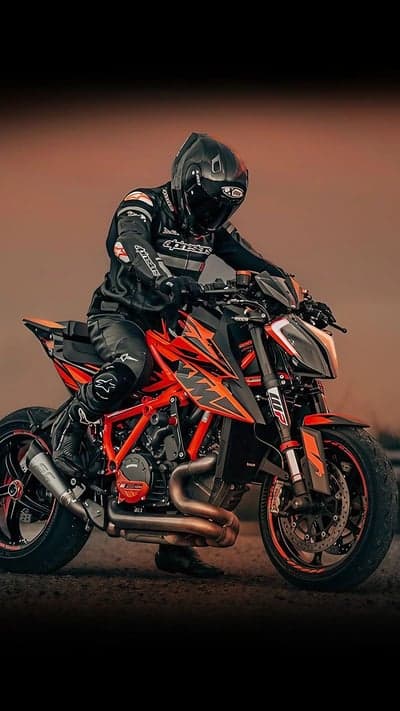 KTM Motorcycle Rider in Black Leather Gear