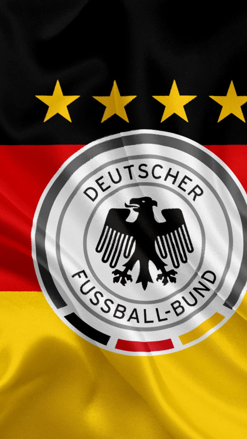 German flag with the DFB eagle emblem and four gold stars waving in a vertical composition with fabric folds.