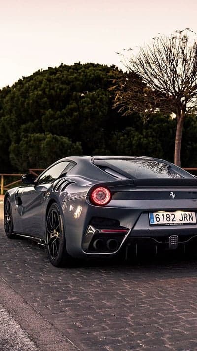 Grey Ferrari F12 TDF Phone Background on Cobblestones