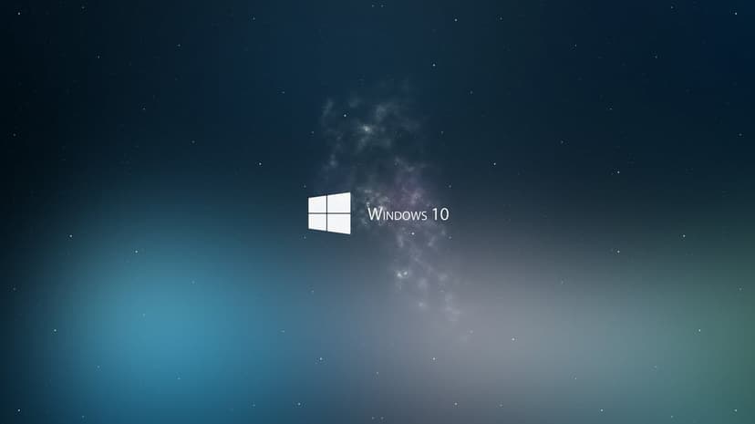 Windows 10 galaxy wallpaper showcasing a glowing blue logo amidst a vibrant cosmic nebula and digital stars.