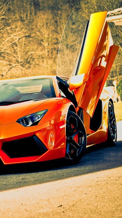 Bright Orange Lamborghini Aventador with Scissor Doors Open