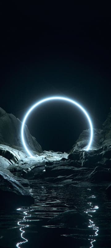 Glowing Ring in Dark Rocky Landscape with Water Reflection