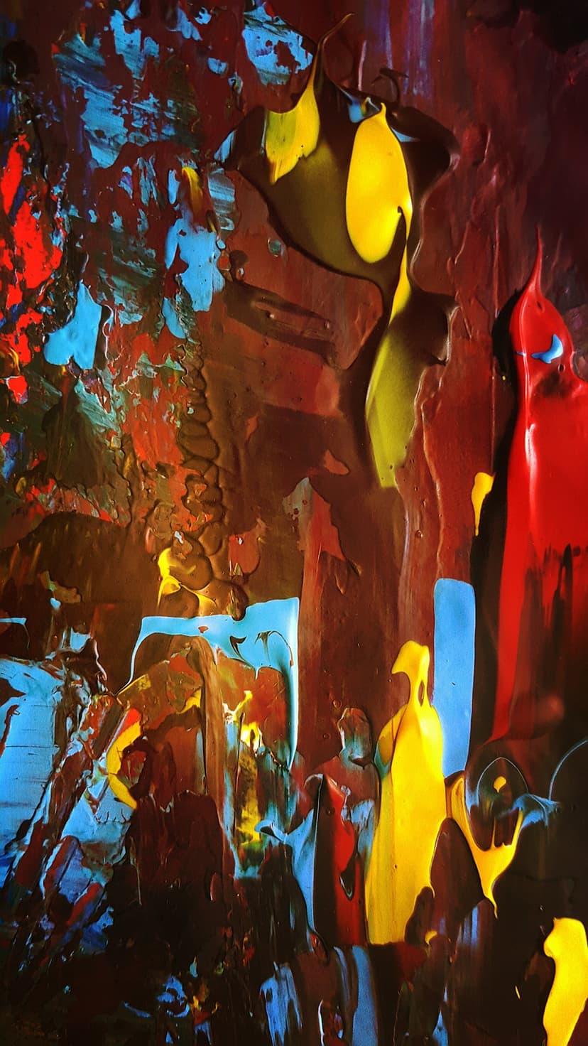 Sculpted layers of crimson, electric blue, and yellow paint form a thick, tactile impasto texture in vertical view.