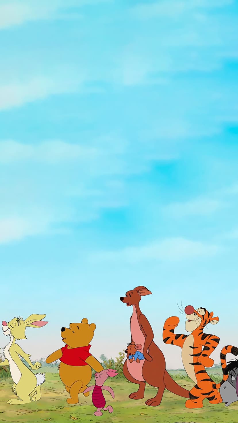 Winnie the Pooh, Tigger, and friends walk through a grassy meadow under a blue sky with soft white clouds.