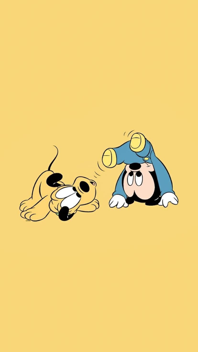Mickey Mouse in blue pajamas poses upside down next to Pluto who lies on a solid bright yellow background.