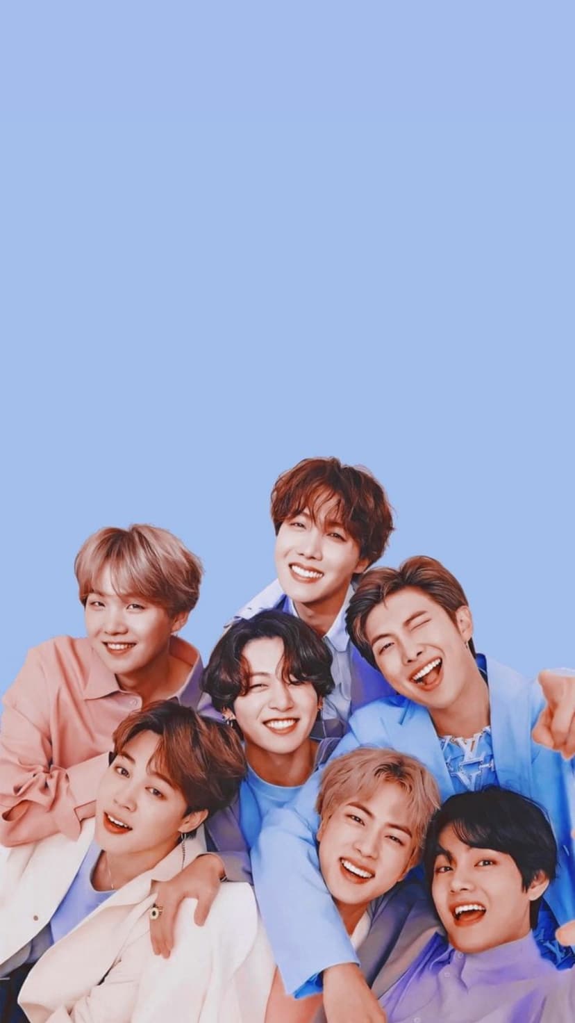 BTS members Jimin, V, Jungkook, Suga, J-Hope, RM, and Jin smile in pastel outfits against a blue background.