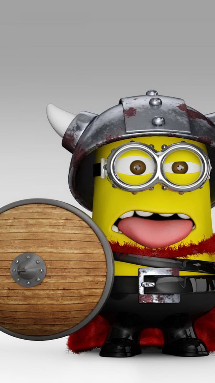 Yellow Minion wearing a horned Viking helmet and red cape, holding a round wooden shield on a gray background.