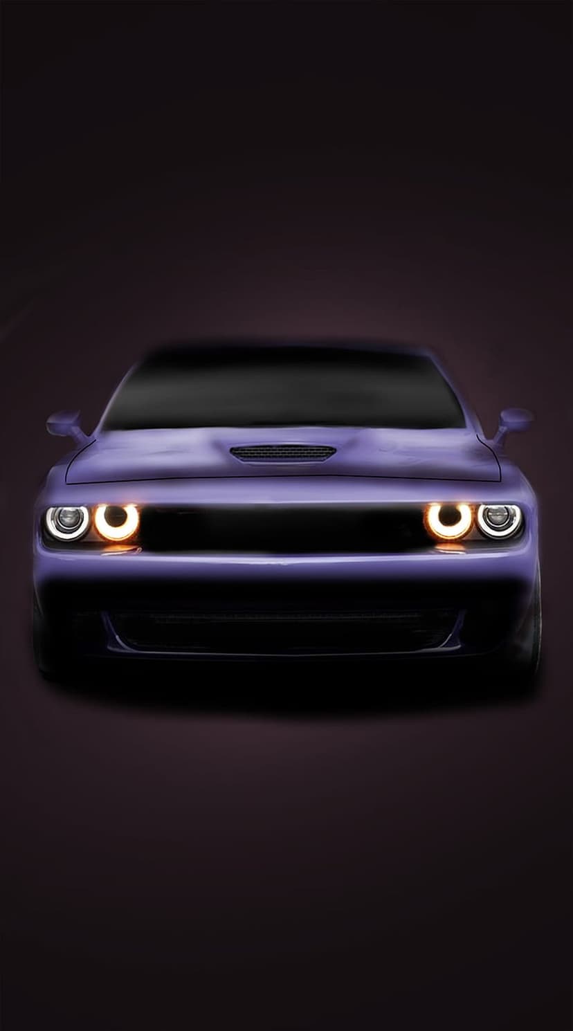Purple Dodge Challenger with glowing circular headlights and aggressive front grille on a black background.