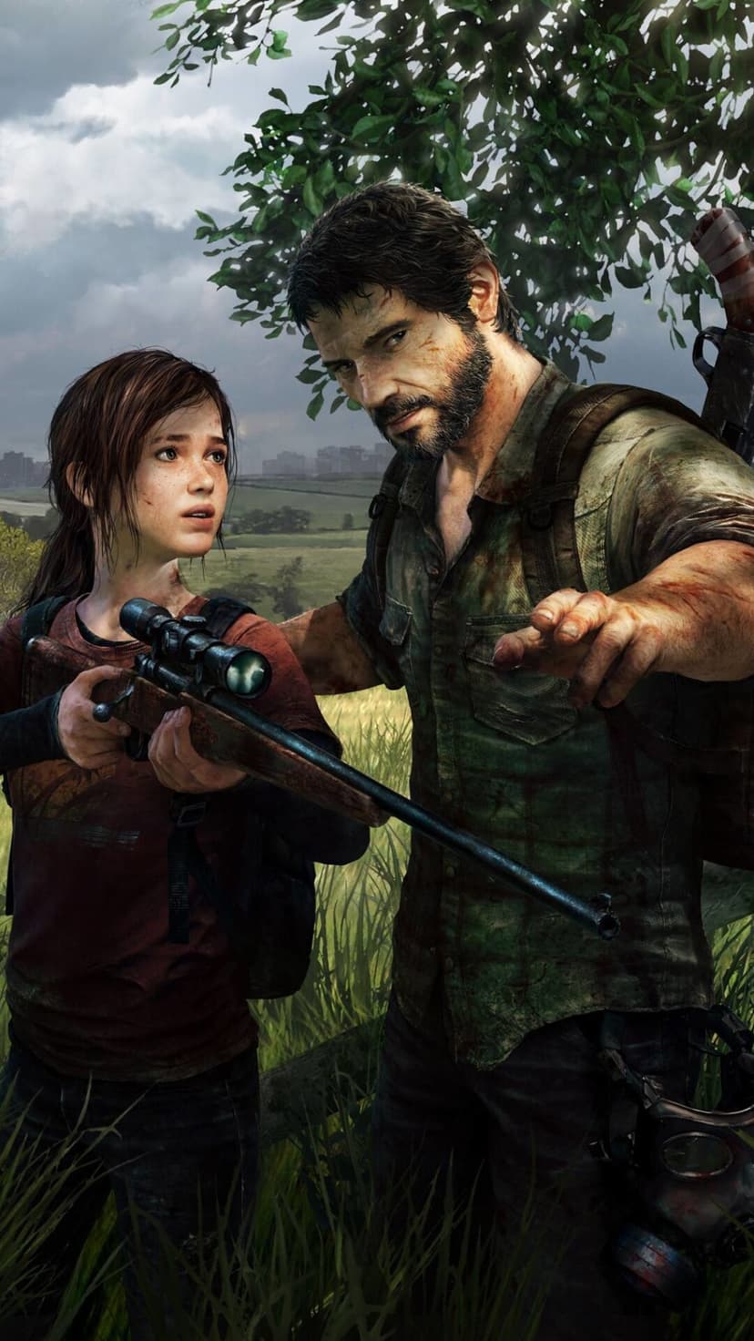 Joel points forward as Ellie holds a scoped rifle in a tall grassy field under a cloudy, overcast sky.
