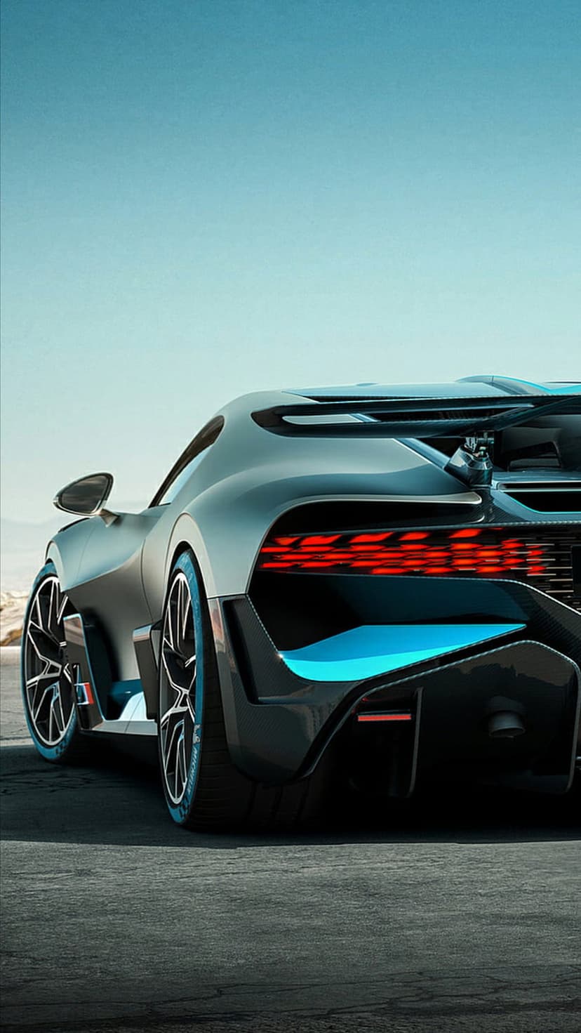 Bugatti Divo rear view featuring a glowing red LED light bar, blue accents, and a carbon fiber diffuser.