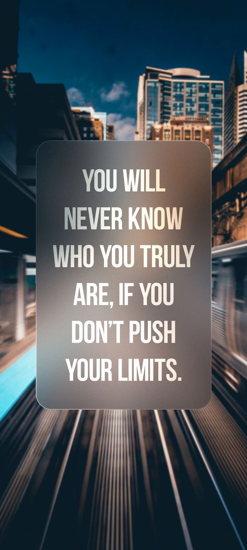 Gray placard with motivational text centered over a blurred urban background with bokeh lights in vertical view.