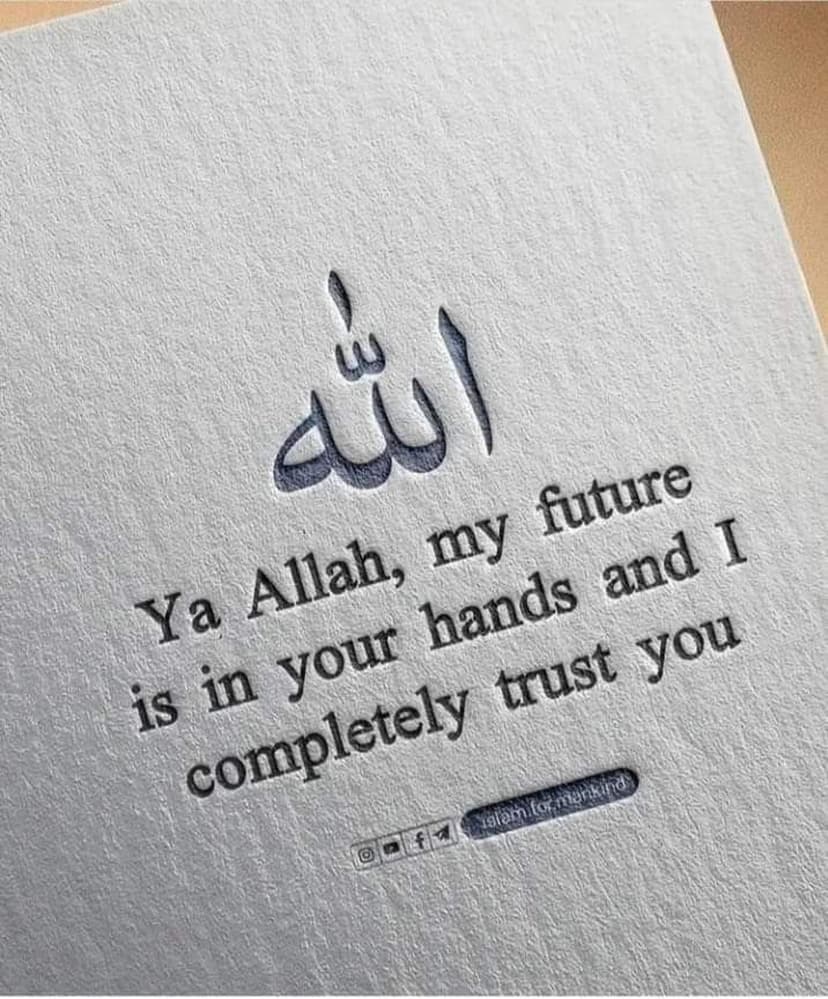 Dark blue Arabic calligraphy and a prayer about trusting God are printed on a white textured paper background.