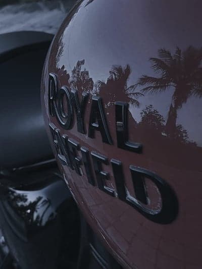 Crimson Royal Enfield Tank Reflection Mobile Wallpaper