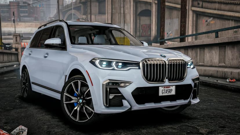 Front view of a light blue BMW X7 SUV parked under a concrete bridge with an industrial city background.