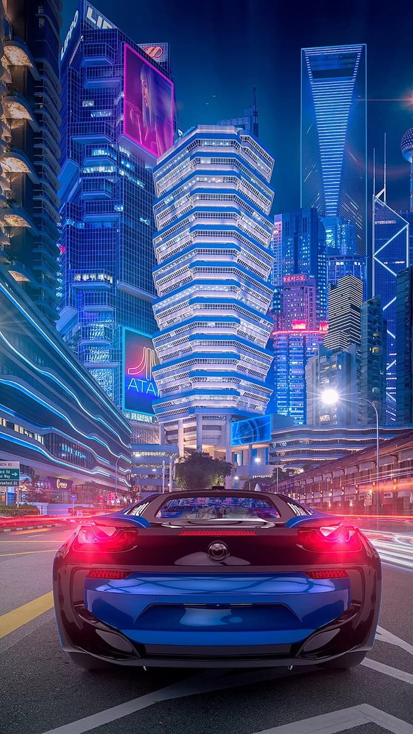 Sleek sports car with glowing red taillights drives on a wet road reflecting blue neon lights from city towers.