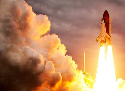 Space Shuttle Launch Ignites Sky with Fiery Ascent