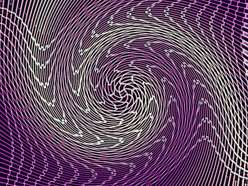Symmetrical purple and white lines spiraling inward to create a deep, hypnotic vortex with high contrast.