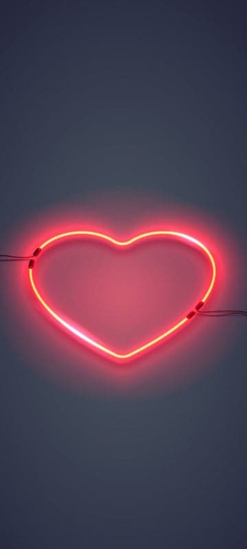 Glowing Red Neon Heart on Dark Background