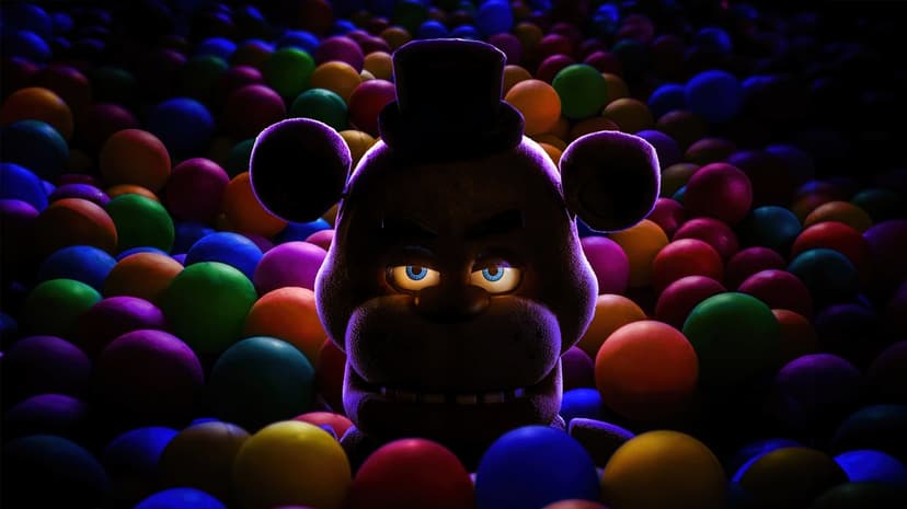 Freddy Fazbear animatronic head shows weathered brown fur and glowing eyes against a dark atmospheric background.