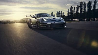 Porsche 911 GT3 Cup Racing Car on Track Sunset Wallpaper