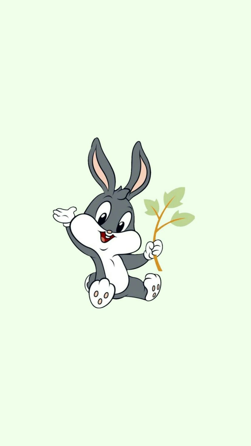 Baby Bugs Bunny sits holding a three-leaf green sprig against a solid pastel mint green background.