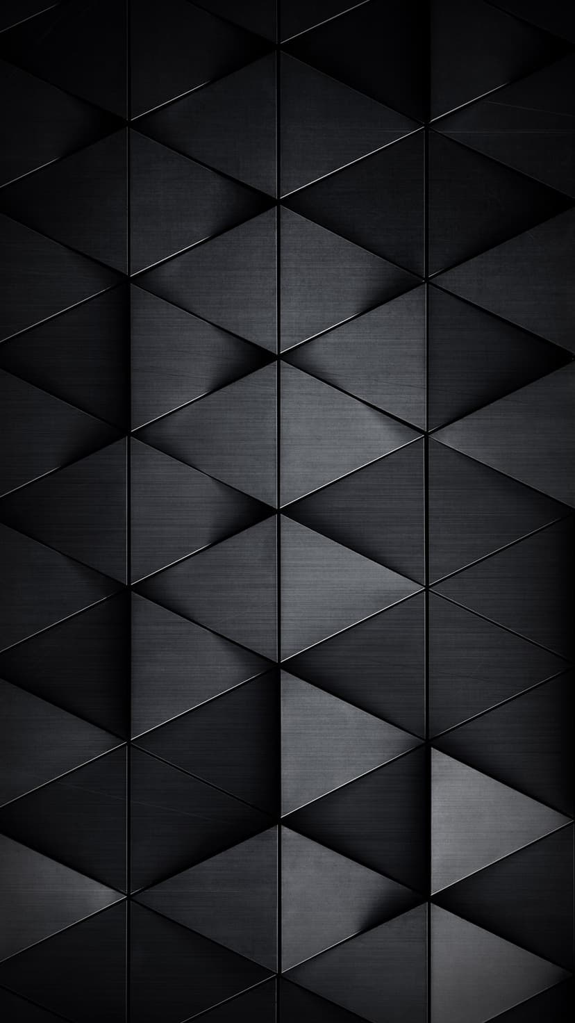 Charcoal gray triangles with brushed metal surfaces overlap to create a three-dimensional geometric pattern.
