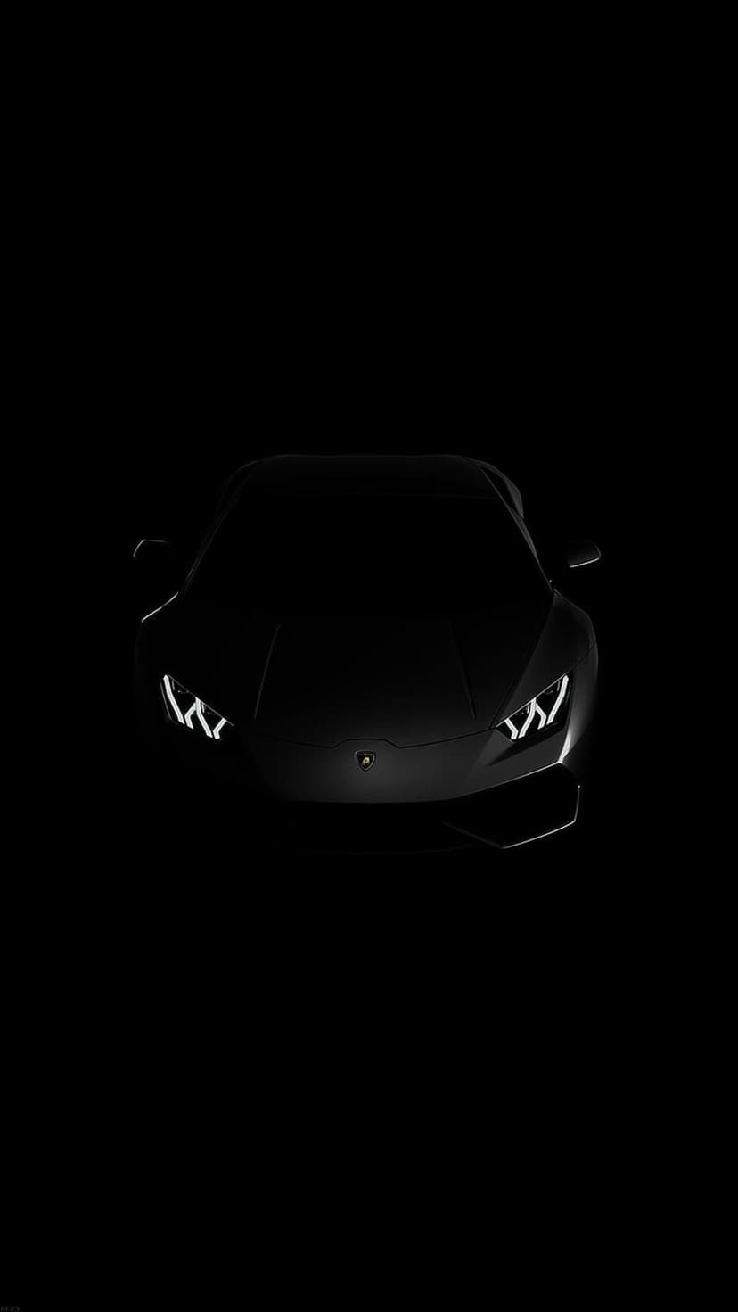 Black Lamborghini sports car with glowing headlights against a dark studio background in a vertical layout.