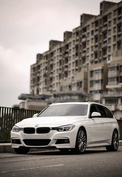 White BMW Touring Estate Urban Street Phone Background