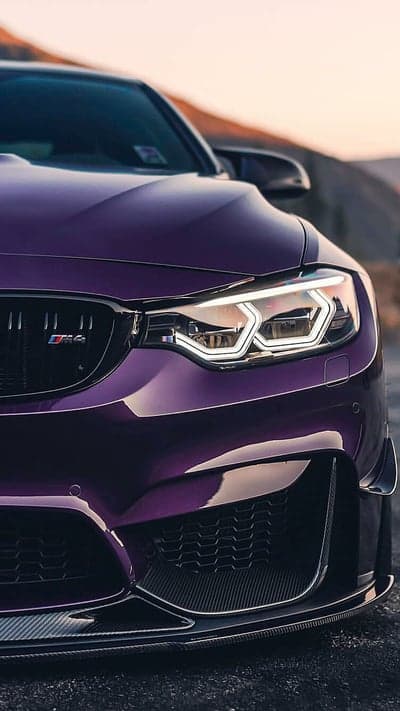 Purple BMW M4 Headlights and Grille Close-up