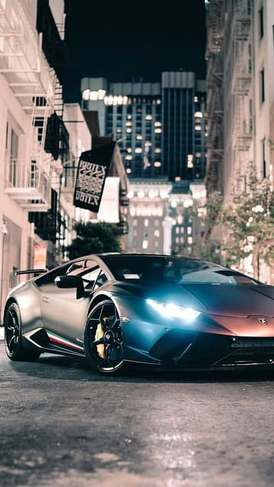 Sleek Lamborghini Supercar Night City Phone Wallpaper