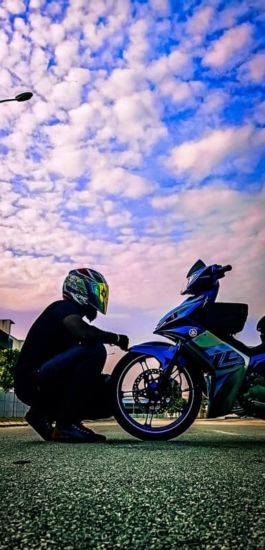 Blue Sportbike Under Dramatic Clouds Mobile Wallpaper