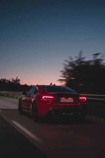 Twilight Highway Red Supercar Night Sky Wallpaper