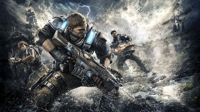 JD Fenix holds a Lancer rifle in a heavy rainstorm with Del Walker and Kait Diaz during a battle.